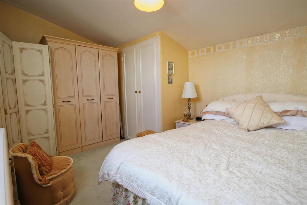 Bedroom Two to the second floor of the apartment.j