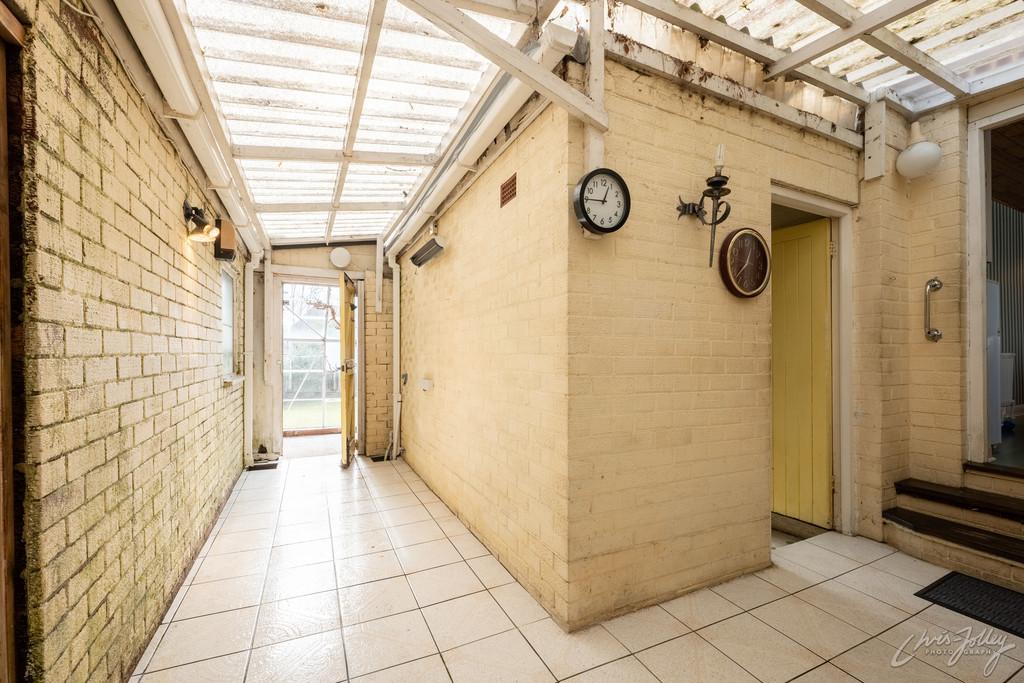 Rear porch to outbuildings and garage
