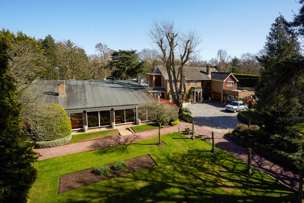 Elevated view of front of the main house, including swimming pool complex