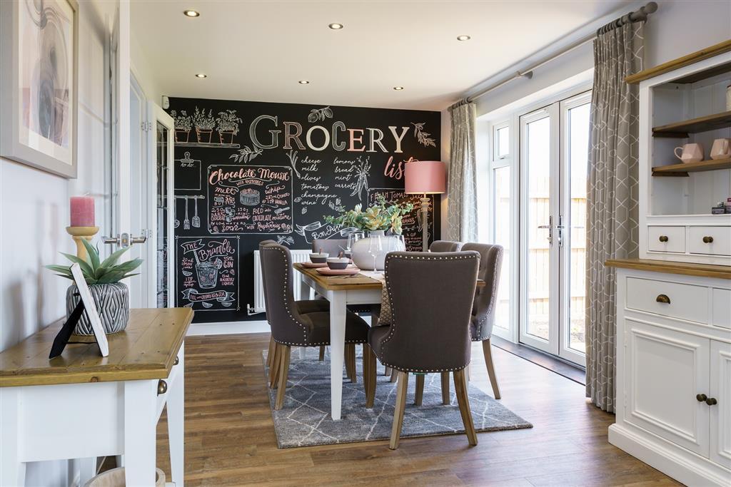 The dining area features double doors out to the garden