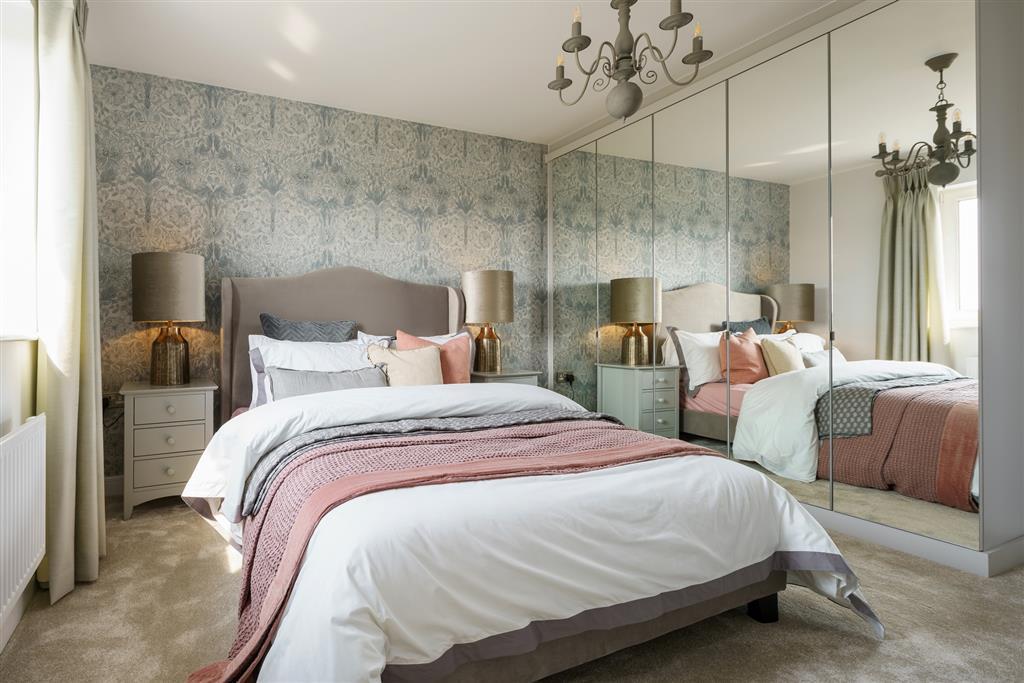 The main bedroom features an en suite shower room