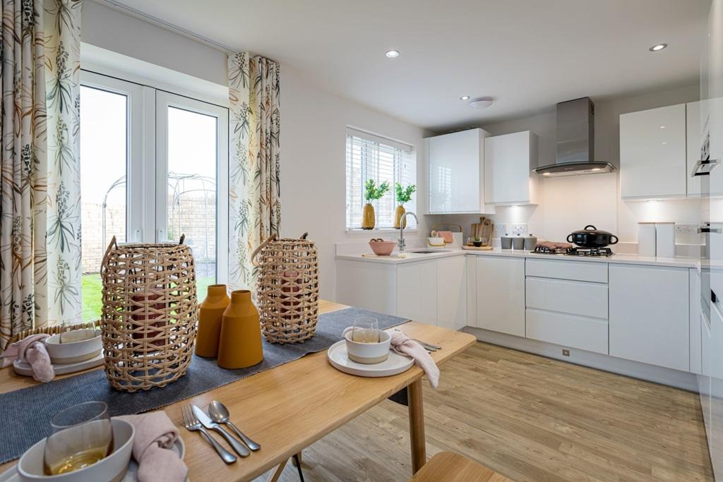 Double doors lead from the open plan kitchen dining area, to garden making alfresco dining easy