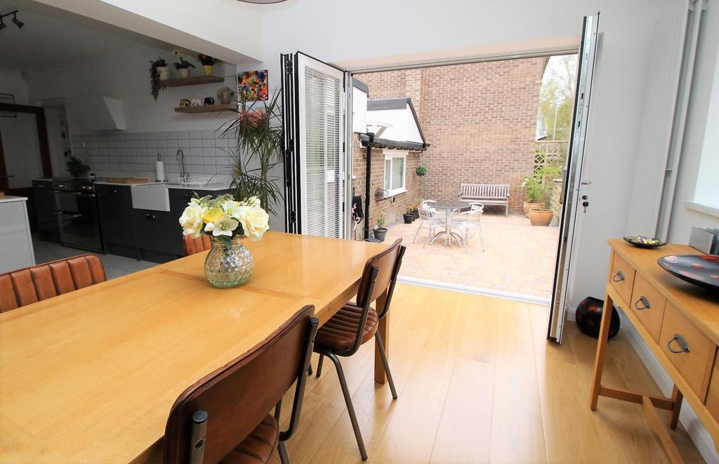 Dining Area through By-Folding doors onto Patio