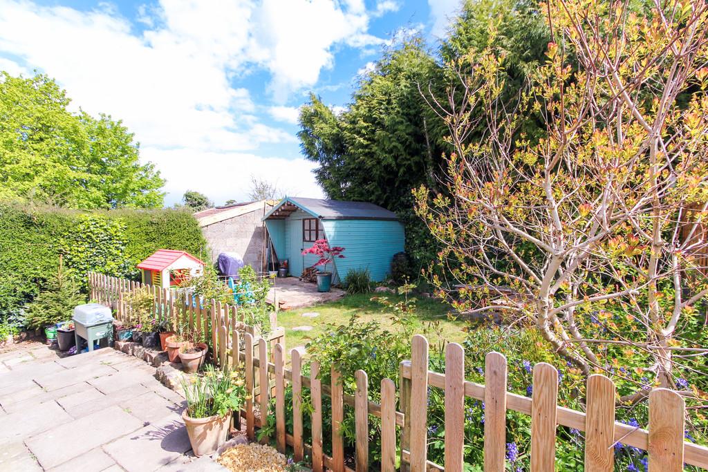 Sunny rear garden with shed