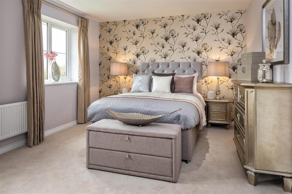 Master bedroom with a private en suite