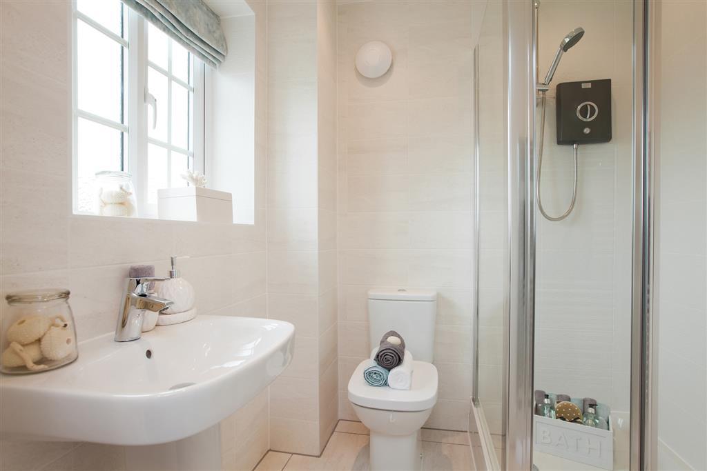 Full height tiling and towel radiator in the en suite