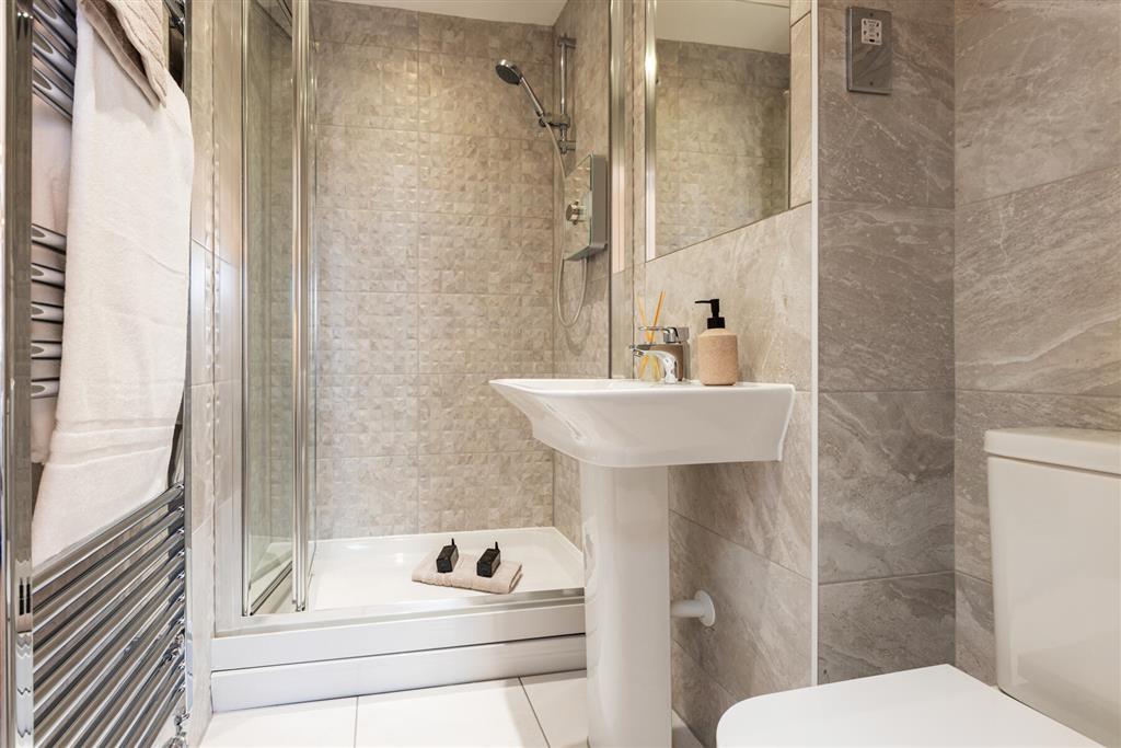 Anen-suite bathroom away from the family