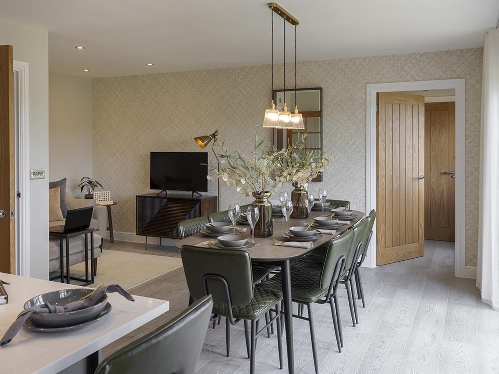 Open plan kitchen/dining/family area leading to the utility and WC