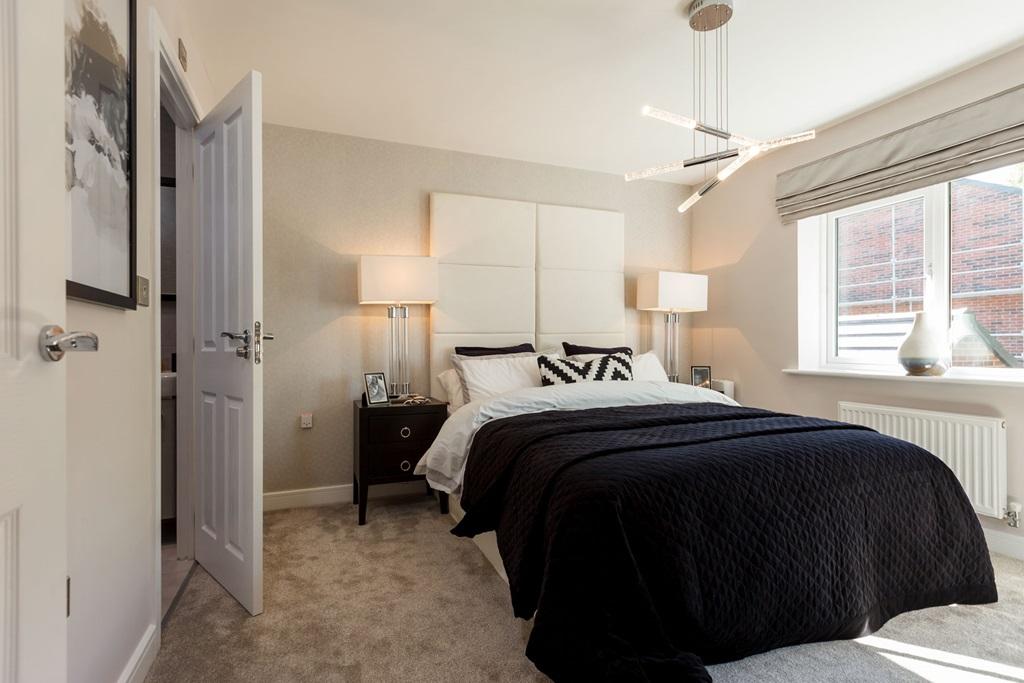 A spacious main bedroom with space to add a fitted wardrobe