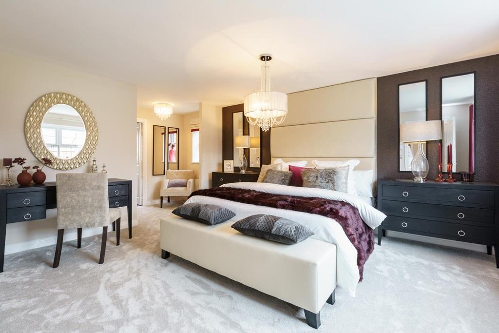 A spacious bedroom with walk-in wardrobe and en suite bathroom