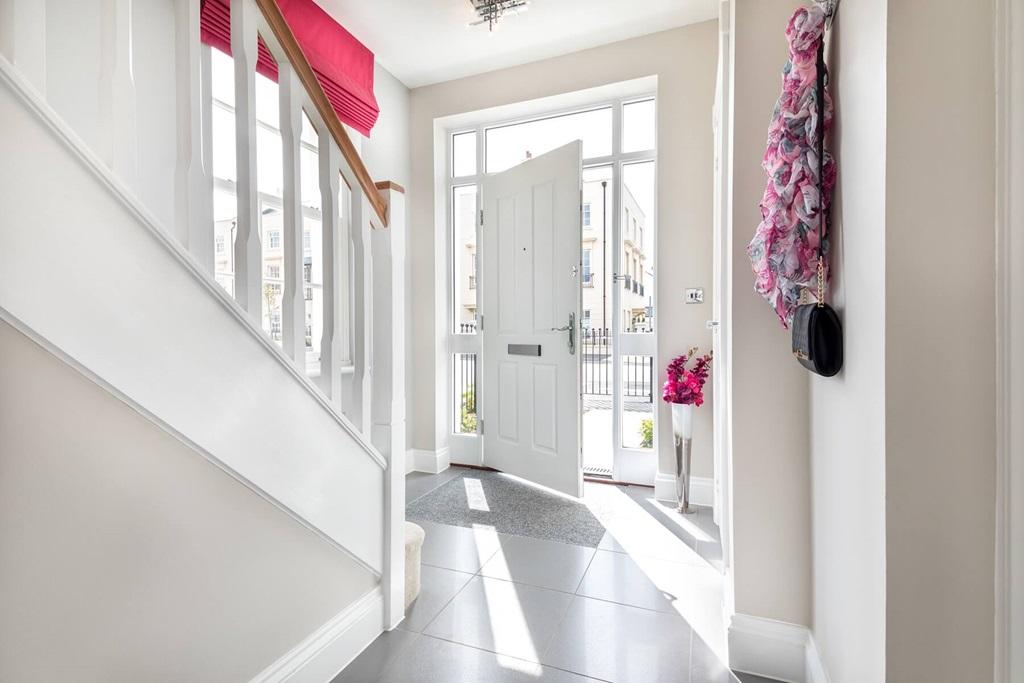 Bright and spacious hallway with under stair storage