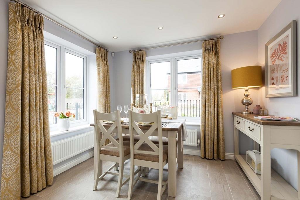 An open plan kitchen and dining area offers space to entertain