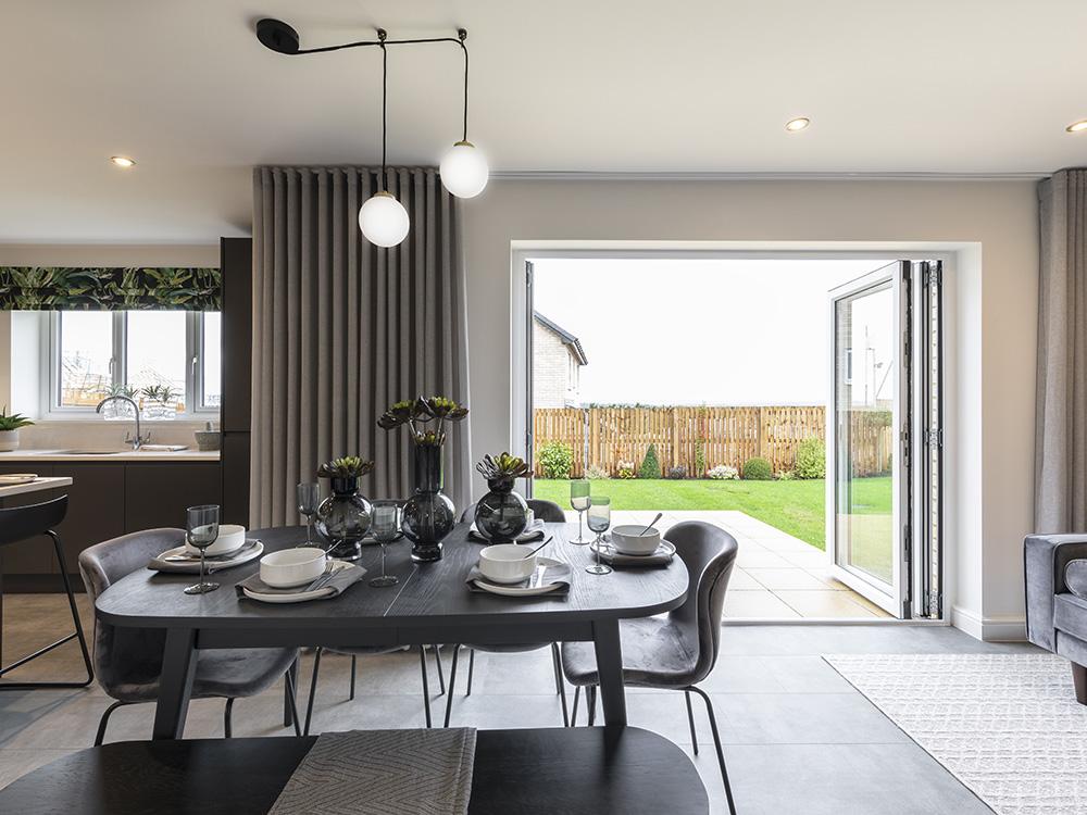 Bi-fold doors to the paved patio and turfed garden