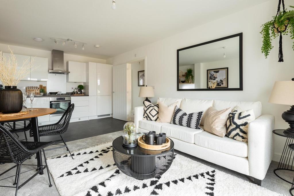 The open plan kitchen/living/dining area with a Juliet balcony