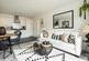 The open plan kitchen/living/dining area with a Juliet balcony