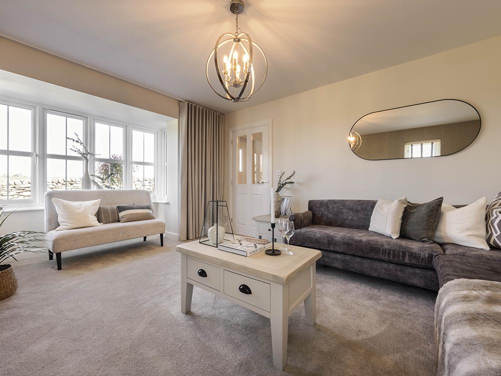 Light &amp; spacious living room with bay window