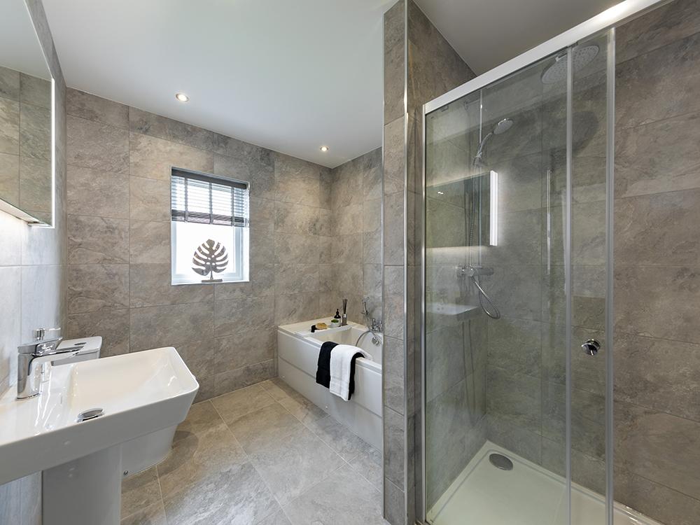 Representation of a Story Homes extensively tiled family bathroom with separate shower