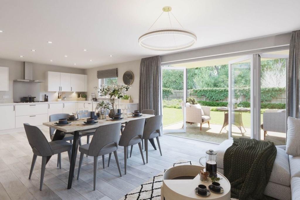 The bright and airy dining area leads through bi-folding doors to the garden