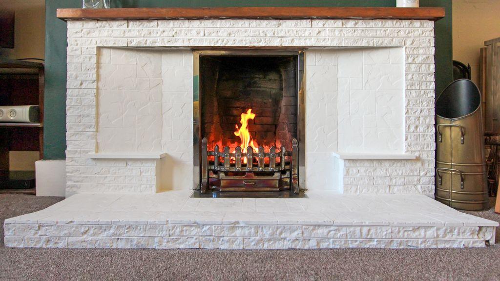 Fireplace with open fire.