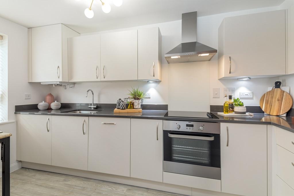 Kitchen and breakfast bar in 3 bed Norbury at Eldebury Place in Chertsey
