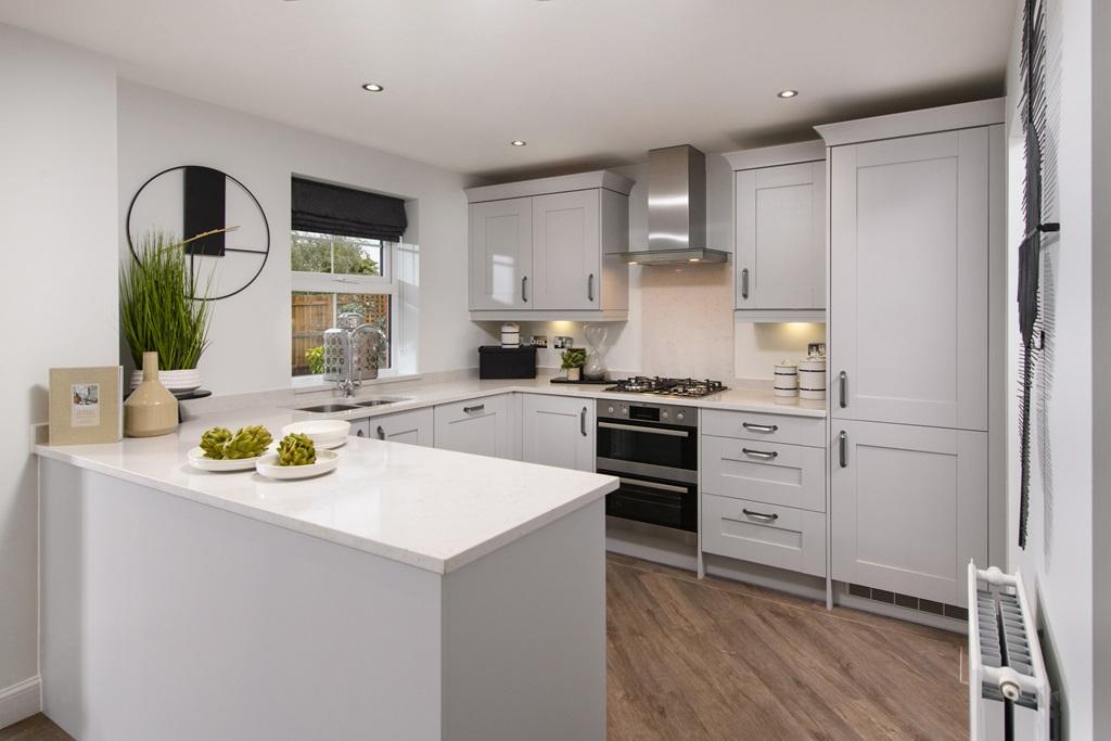 Open-plan kitchen with integrated appliances in the Radleigh