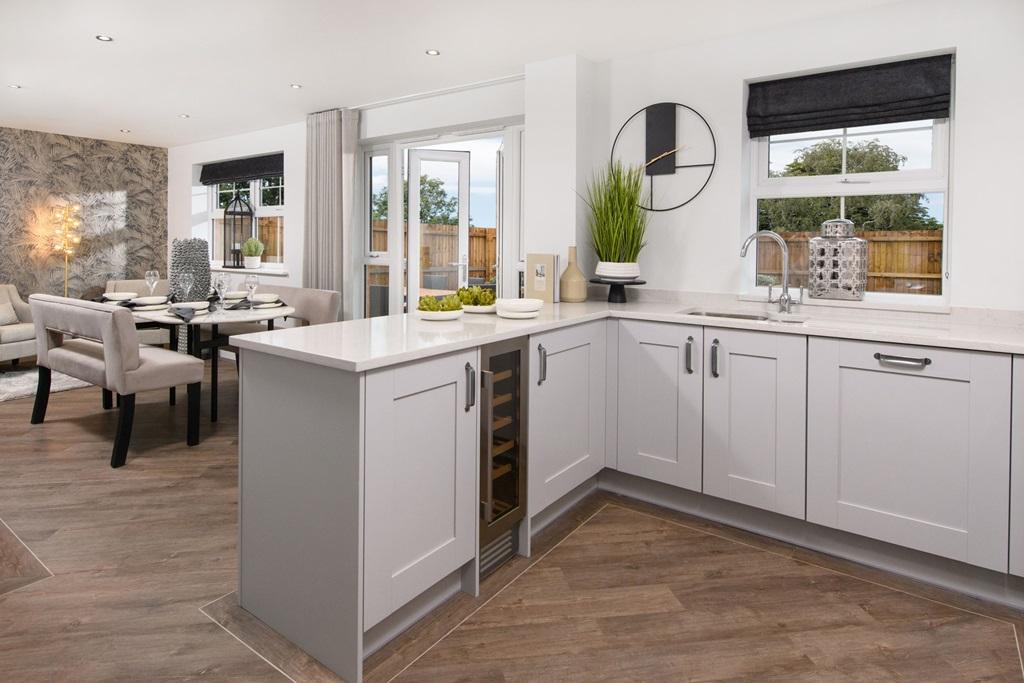 The Radleigh - Open-plan kitchen/dining area with French doors onto garden