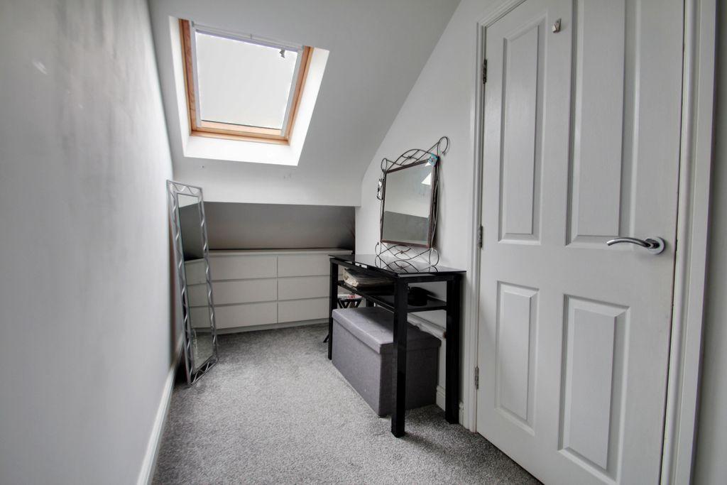 Dressing area to bedroom 3.