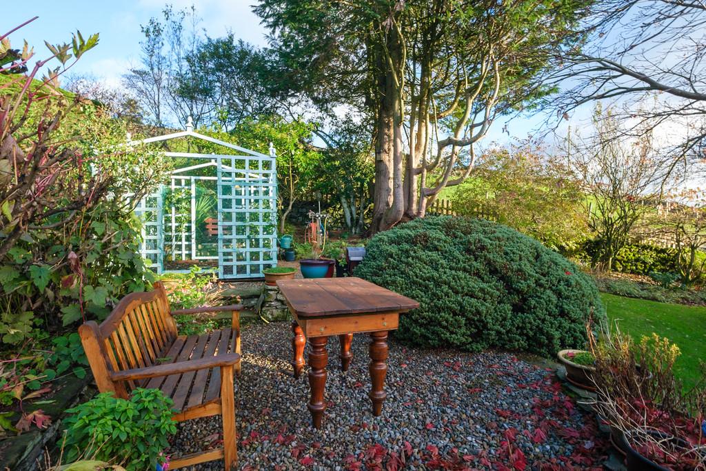 Sheltered sitting are with rose arbour