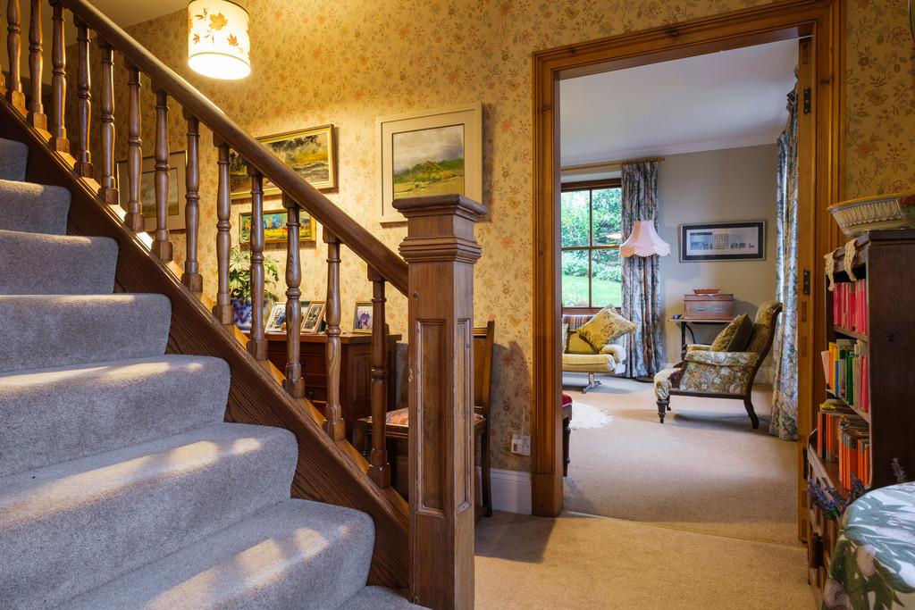 Welcoming entrance with pitch pine staircase