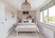 The second double bedroom welcomes plenty of natural light