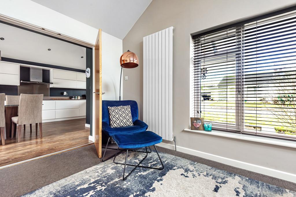 Living room with double doors to dining kitchen