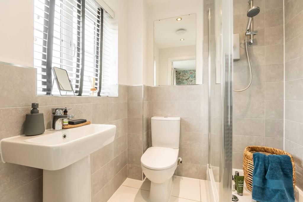 An en suite shower room away from the family
