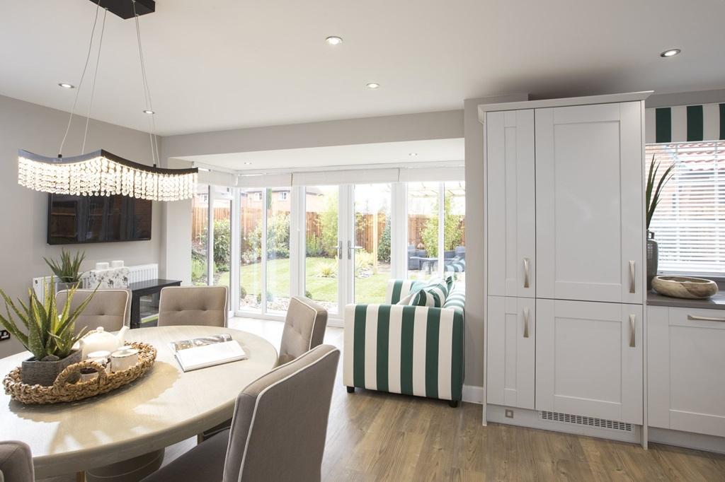 Open plan kitchen&#96;s glazed bay with French doors