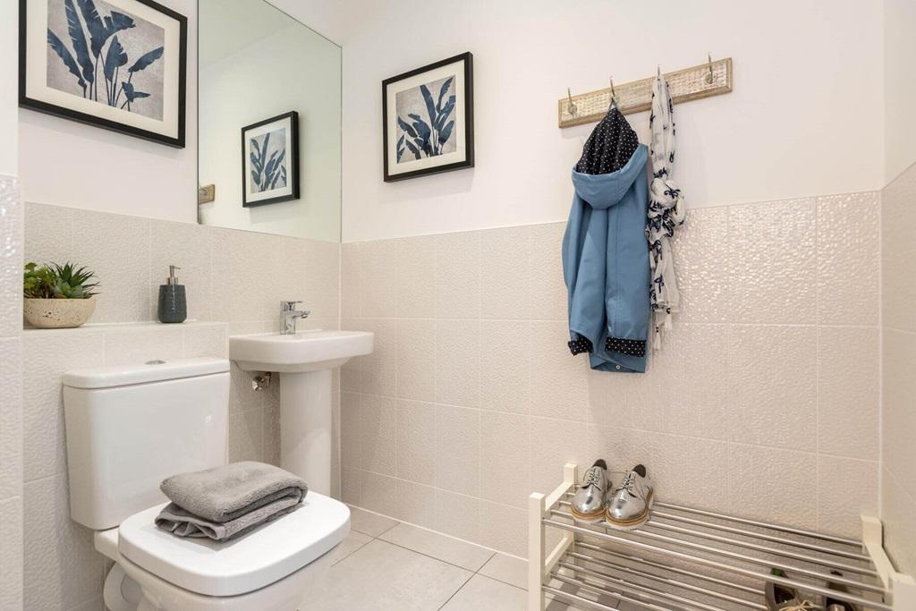 A guest cloakroom completes the ground floor