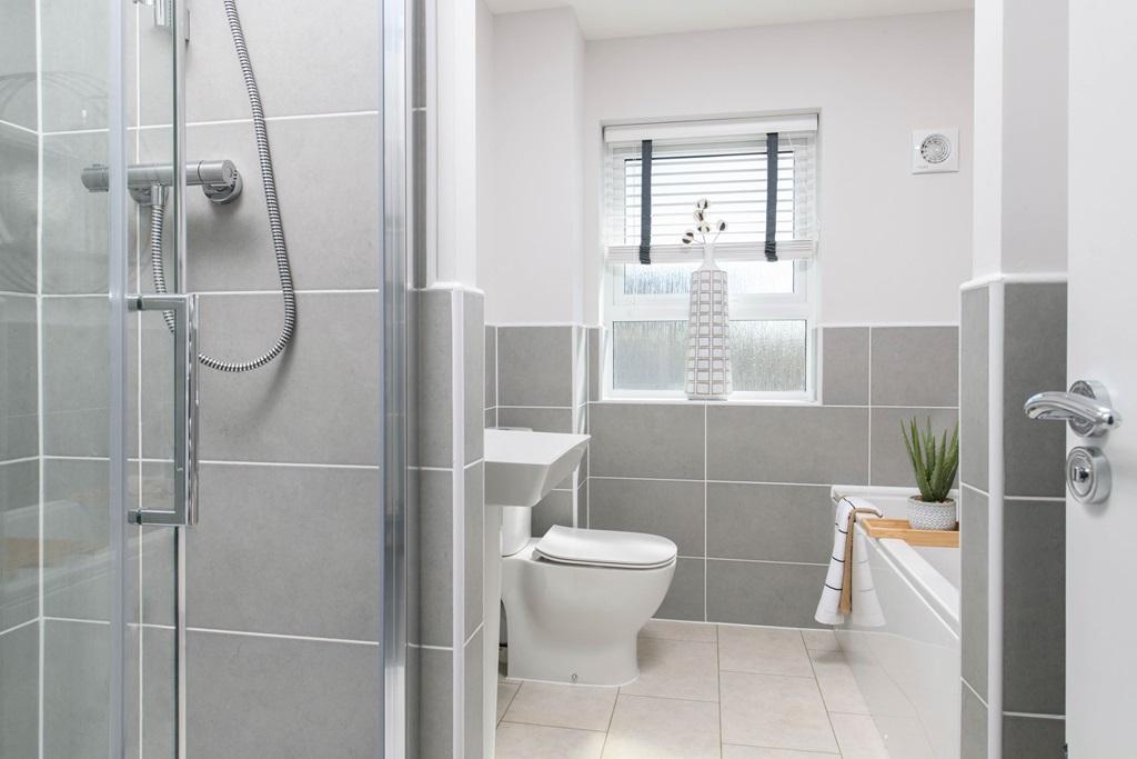 Family bathroom with separate shower, bath, basin & toilet in Millford style home
