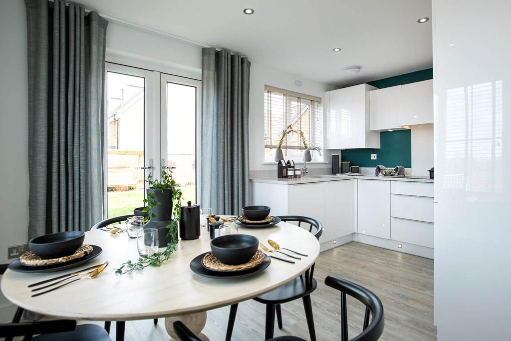 The kitchen/dining area boasts double doors out to the garden