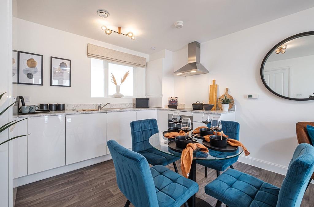 Interior view open plan kitchen &amp; dining in our 2 bed show apartment