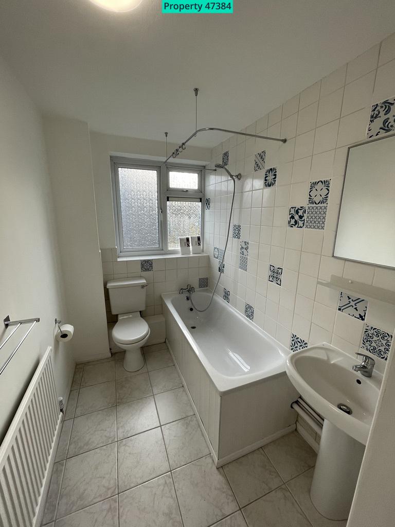 Bathroom with bath and shower