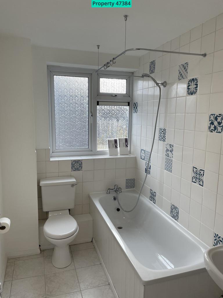 Bathroom with bath and shower