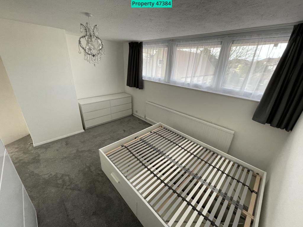 Bedroom with double bed and chest of drawers