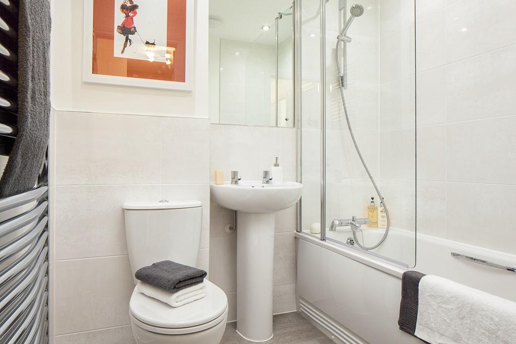 A shower over the bath in the main bathroom adds convenience