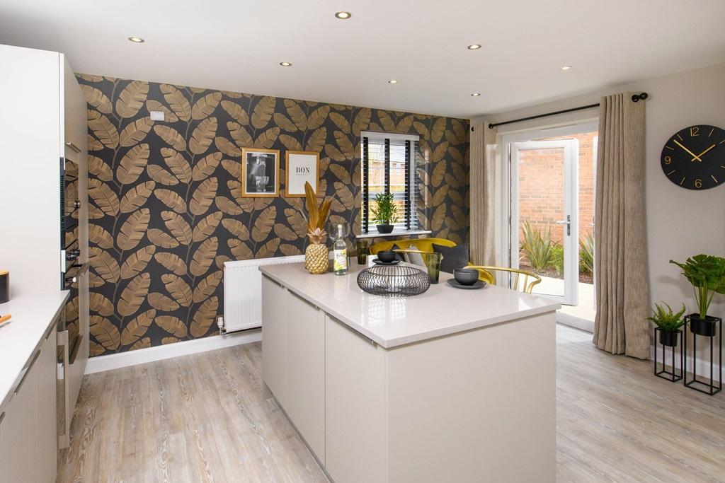 Alderney kitchen with breakfast island and French doors leading to the rear garden