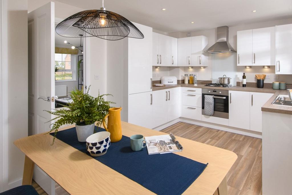 Open-plan kitchen/diner in Maidstone with French doors leading to garden