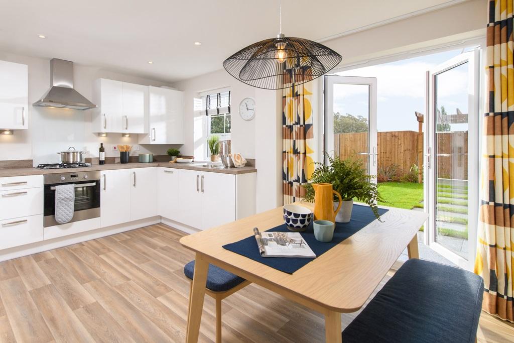 Open-plan kitchen/diner in Maidstone with French doors leading to garden