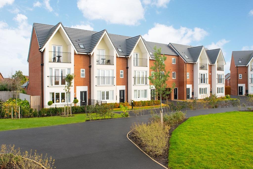 External shot of a row of Hesketh housetypes with open green landscaped area in front