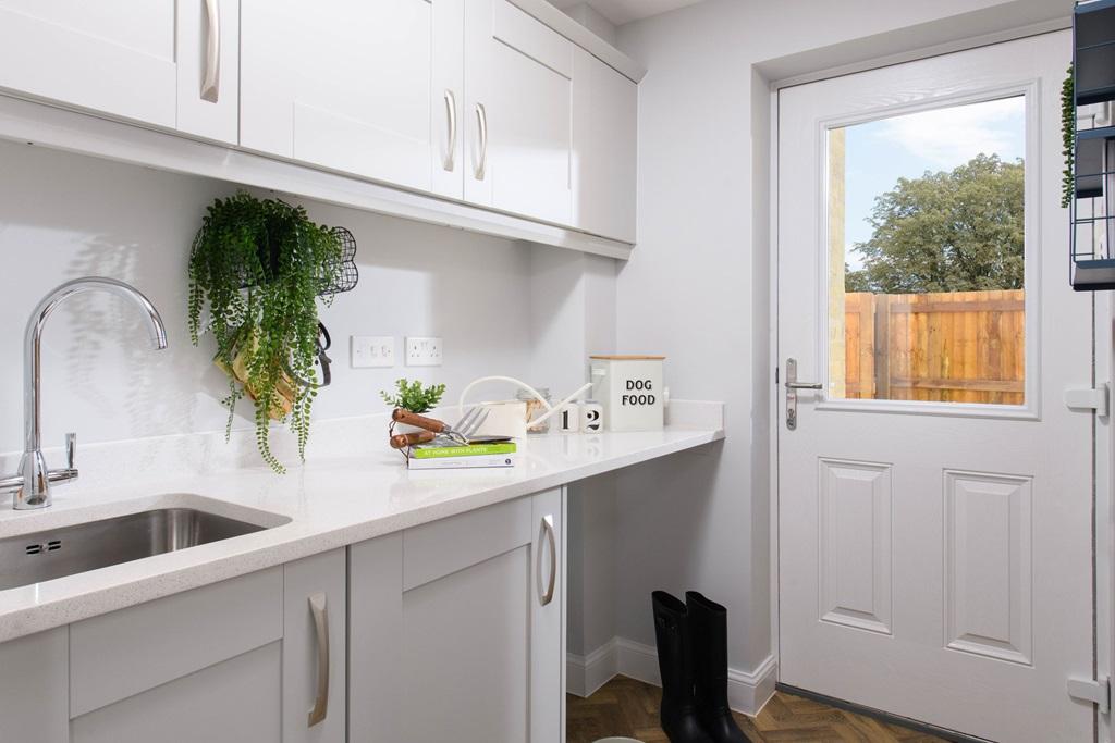 Separate utility area in Avondale style home with access to rear garden