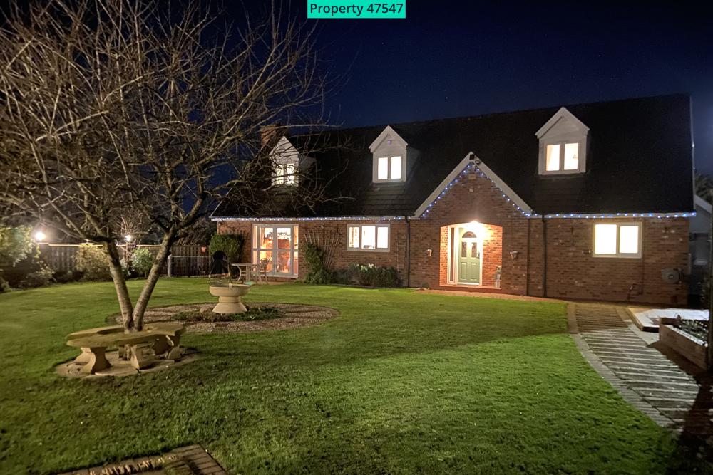 Evening rear view of house