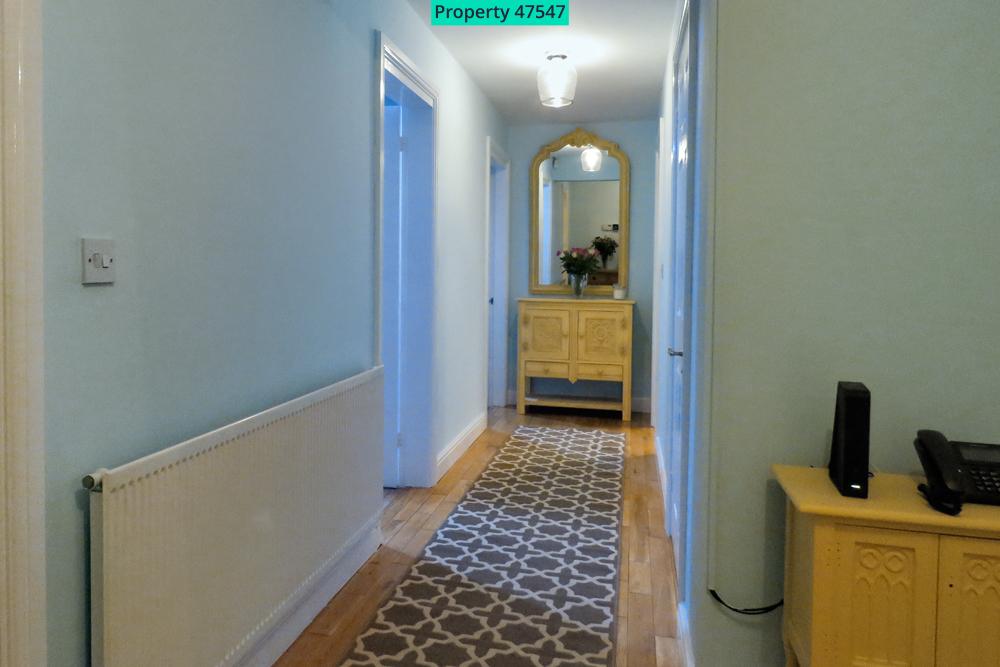 Hallway leading to office and bedroom Four