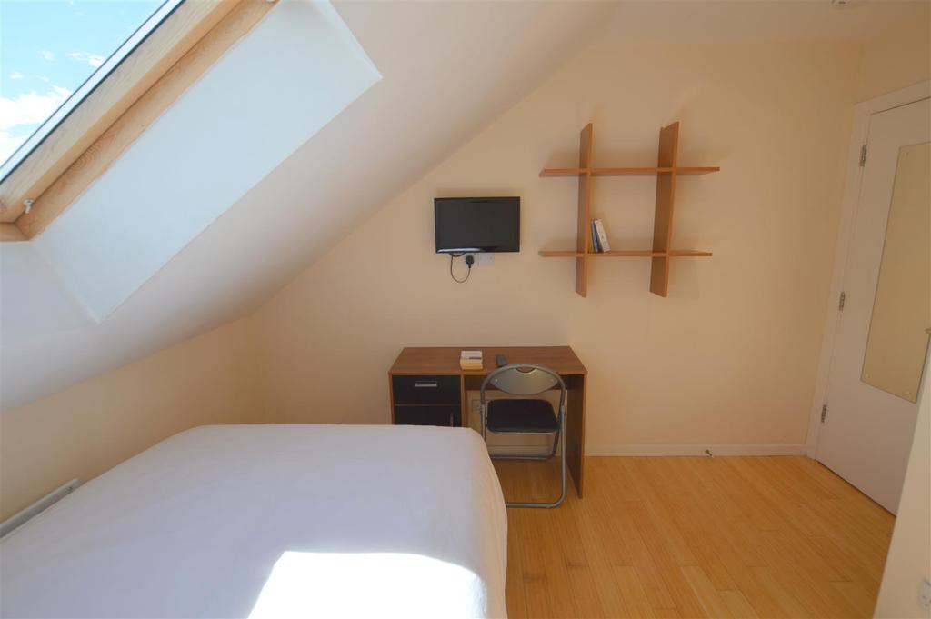 103 Tosson Terrace Yellow Bedroom.jpg