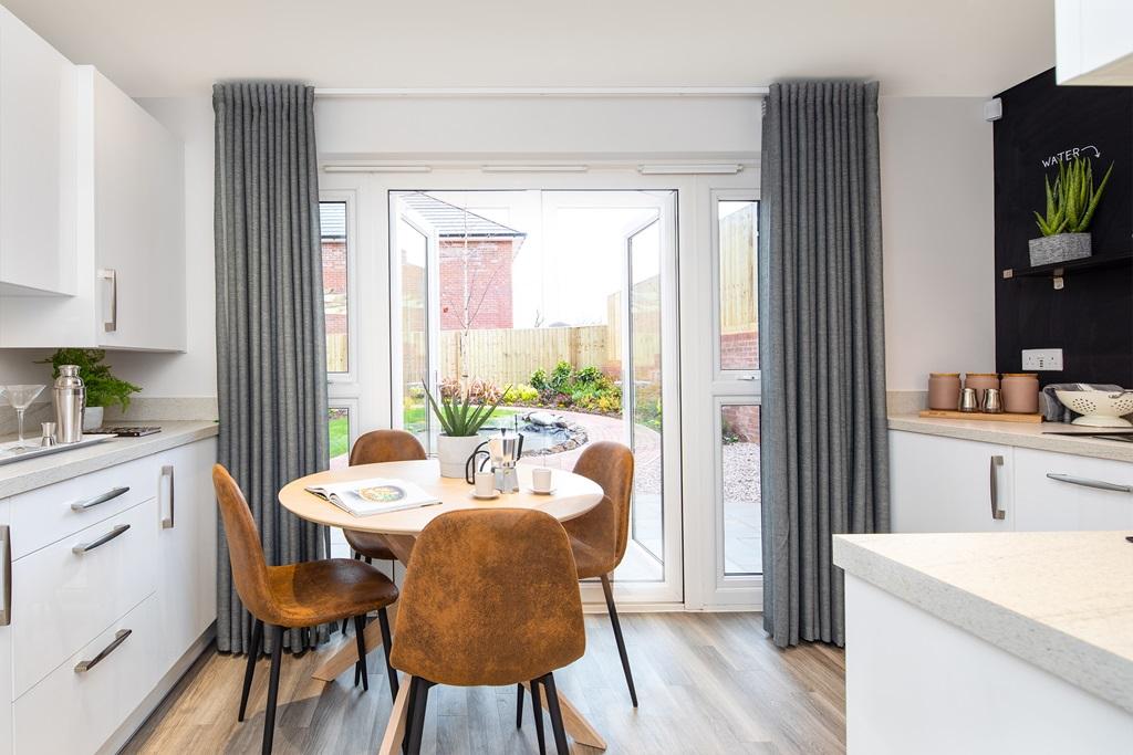Kitchen with dining area and French doors in the Kenley 2 bedroom home
